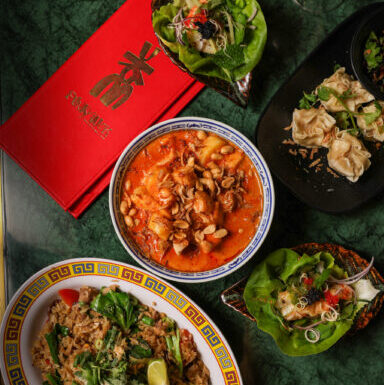 Happy diners enjoying coastal modern Thai feast