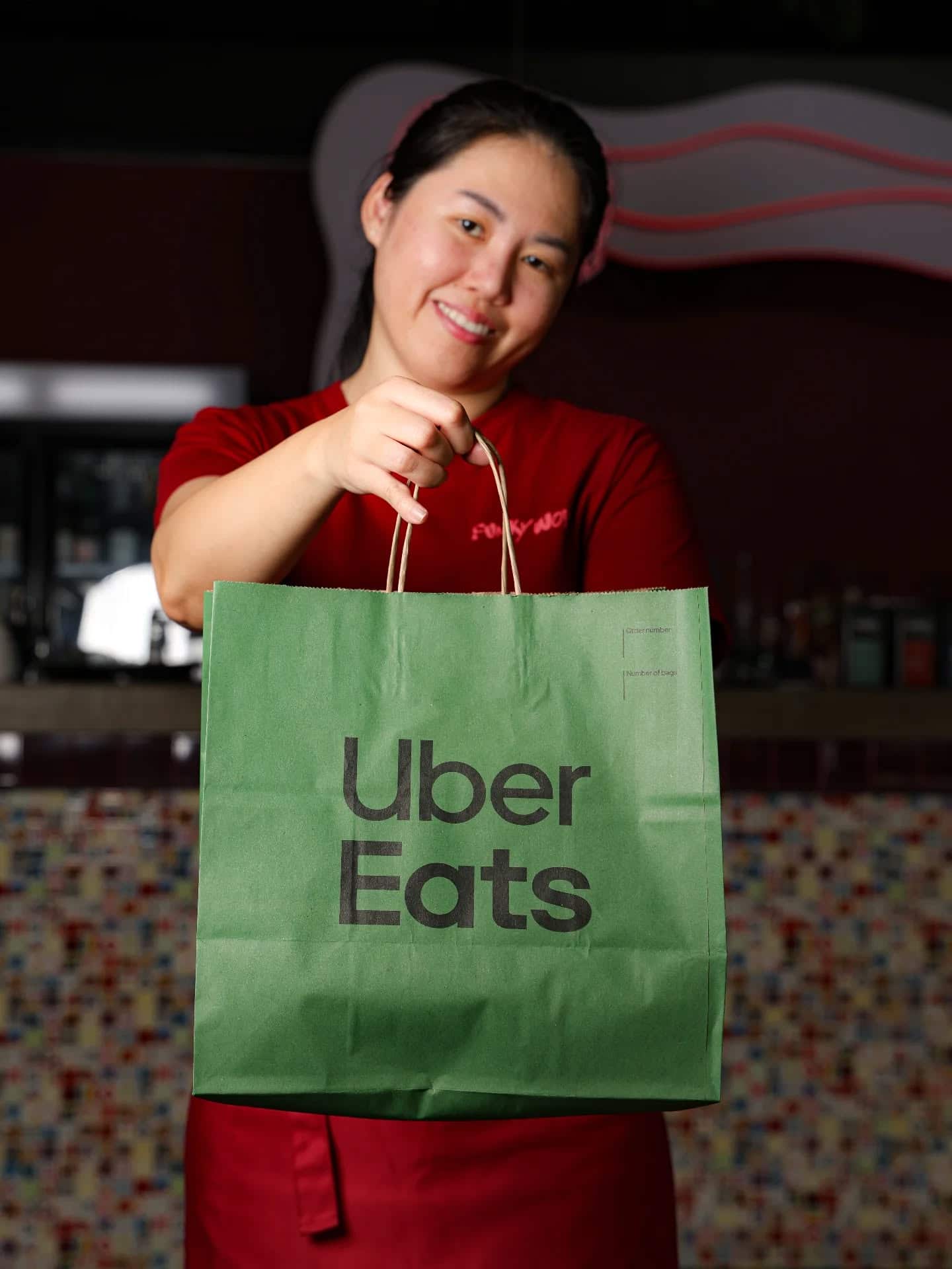 A team member with a takeaway order