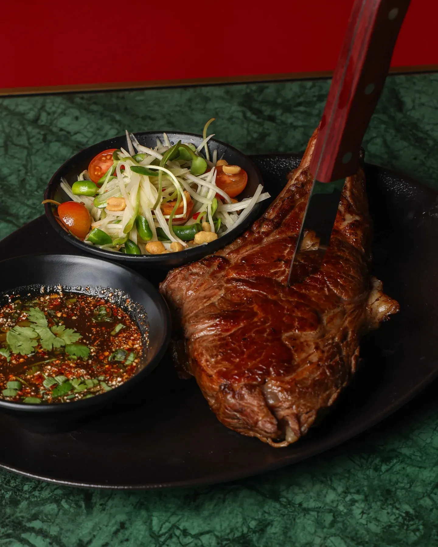 Beef tomahawk with shared dishes