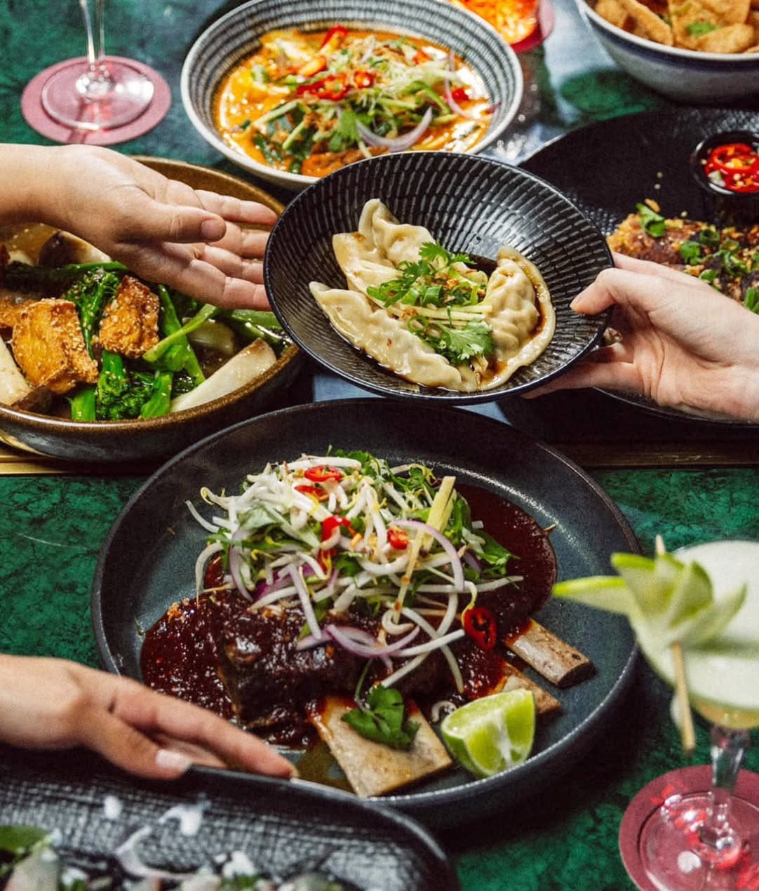 Hands sharing a spread