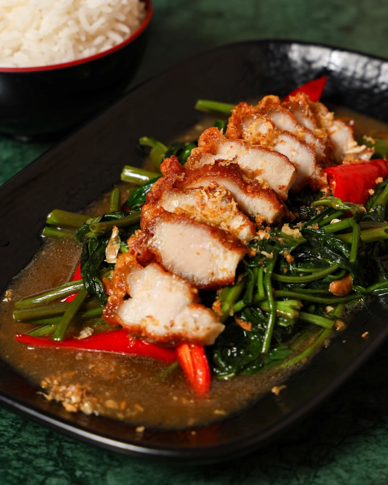 Morning glory with crispy pork belly