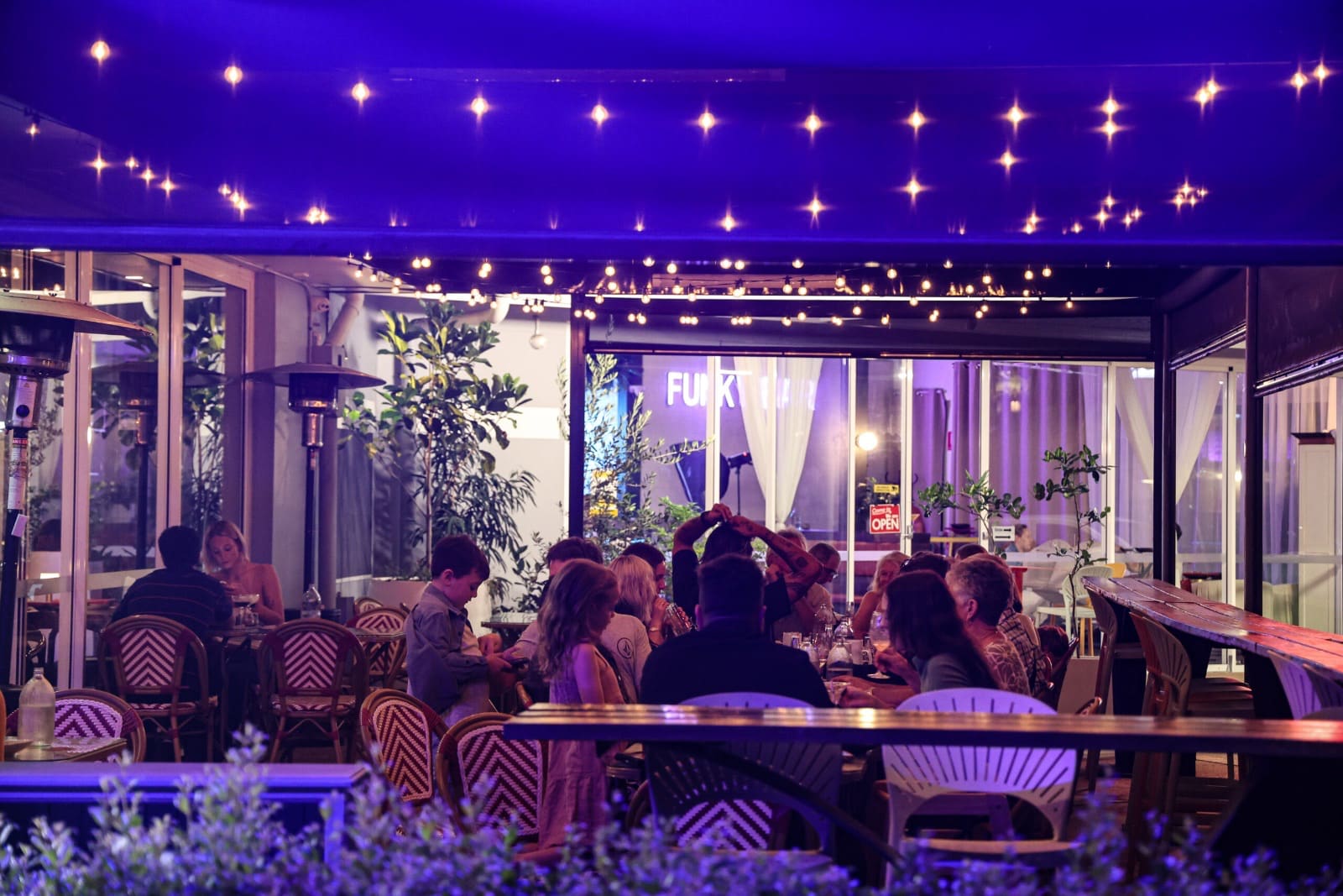 Festoon lights over the courtyard at night